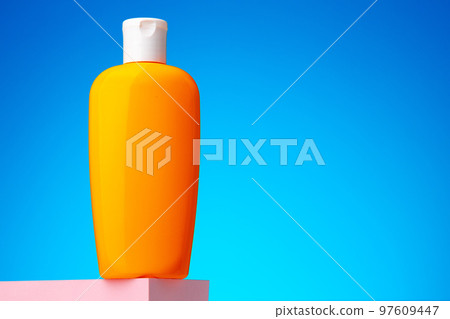 Skincare beauty products container against blue background Skincare beauty products container against blue background 97609447