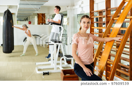 Portrait of slender woman in the gym for self defense exercises Portrait of slender woman in the gym for self defense exercises 97609539