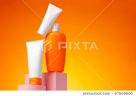 Skincare beauty products container against pink background 97609600