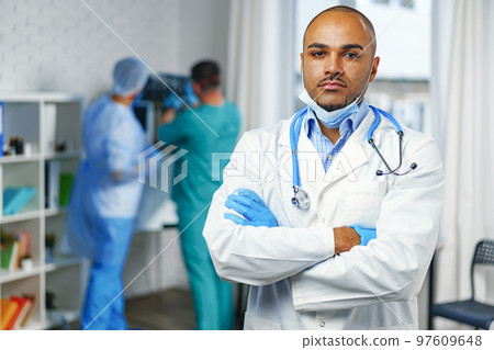 Portrait of african american doctor, hospital background Portrait of african american doctor, hospital background 97609648