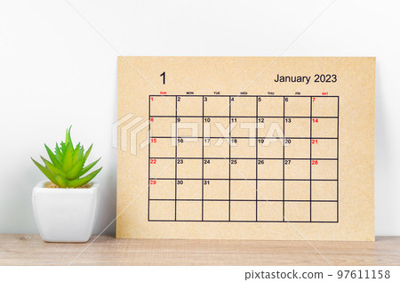 The January 2023 Monthly calendar for 2023 year on wooden table. 97611158