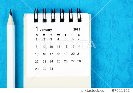 The January 2023 Monthly desk calendar for 2023 with pencil on blue background. 97611161
