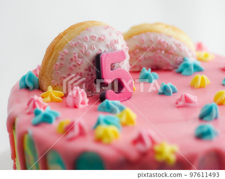 pink 5th anniversary birthday frosted icing dripping cake on white background pink 5th anniversary birthday frosted icing dripping cake on white background 97611493