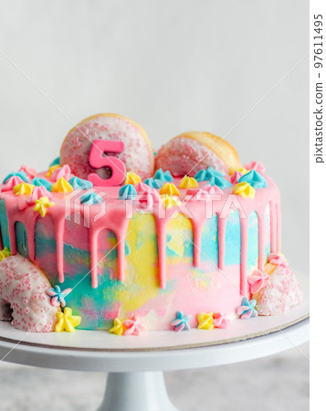 pink 5th anniversary birthday frosted icing dripping cake on white background pink 5th anniversary birthday frosted icing dripping cake on white background 97611495