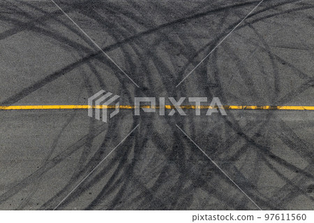 Tire tracks texture and background, Asphalt texture with line and tire marks, Automobile automotive tire skid mark on race track, Abstract texture car drift tire skid mark. 97611560