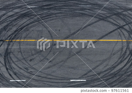 Tire tracks texture and background, Asphalt texture with line and tire marks, Automobile automotive tire skid mark on race track, Abstract texture car drift tire skid mark. 97611561