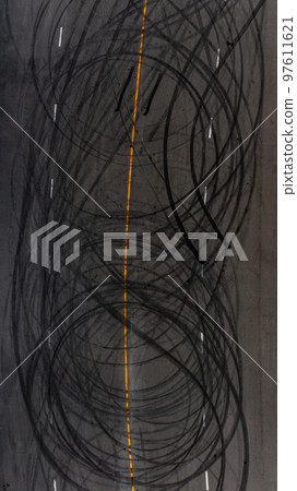Top view tire tracks texture and background, Asphalt texture with line and tire marks, Automobile automotive tire skid mark on race track, Abstract texture car drift tire skid mark. Top view tire tracks texture and background, Asphalt texture with line and tire marks, Automobile automotive tire skid mark on race track, Abstract texture car drift tire skid mark. 97611621