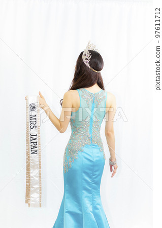 A woman in a dress 97611712