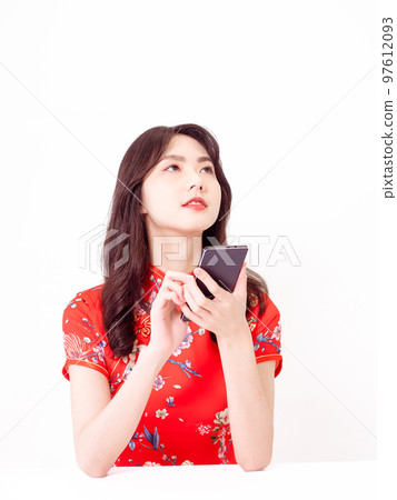 traditional cheongsam using smart phone isolated on white background 97612093