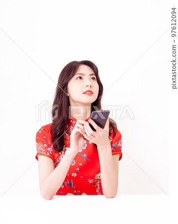 traditional cheongsam using smart phone isolated on white background traditional cheongsam using smart phone isolated on white background 97612094
