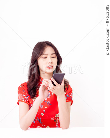 traditional cheongsam using smart phone isolated on white background 97612095