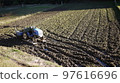 tractor in the rice field 97616696