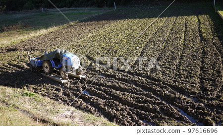 tractor in the rice field tractor in the rice field 97616696
