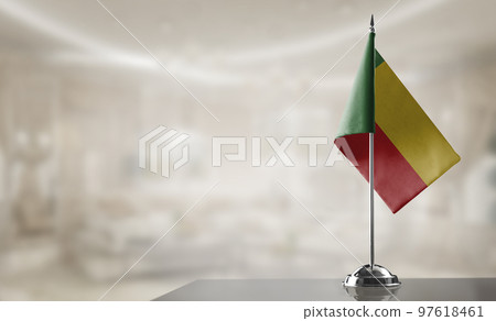 A small Benin flag on an abstract blurry background 97618461