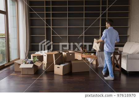 Real estate property buyer man moving into new apartment 97618970