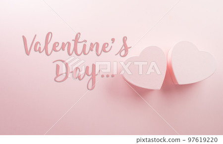 Happy valentine's day and love decoration background concept made from two hearts and the text on pastel pink background. Happy valentine's day and love decoration background concept made from two hearts and the text on pastel pink background. 97619220