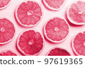 Fresh grapefruit slices in Viva magenta - color of year 2023. summer concept 97619365