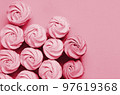 Colorful marshmallows on magenta background. Color of year 2023. Viva magenta. Color sweet homemade zephyr 97619368