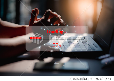 Man using laptop for download software and waiting to loading digital business data form website, concept of waiting for load of loading bar. 97619574
