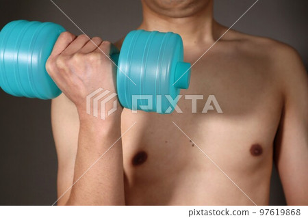 man lifting dumbbells man lifting dumbbells 97619868