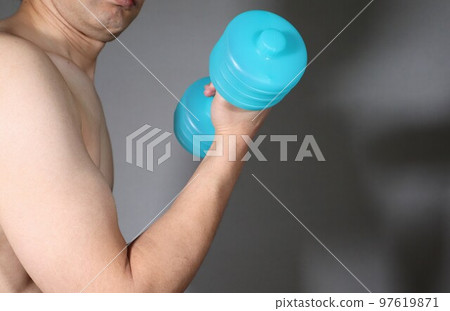 Naked man training with dumbbells Naked man training with dumbbells 97619871