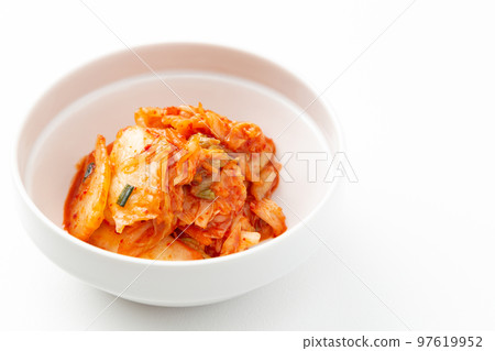 Kimchi served on a small plate with a white background 97619952