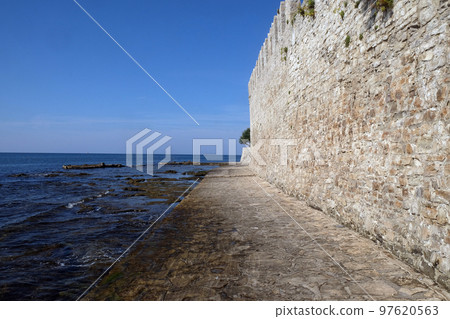 Beach in the small idyllic city Novigrad located on the west coast of Istria peninsula, Croatia Beach in the small idyllic city Novigrad located on the west coast of Istria peninsula, Croatia 97620563