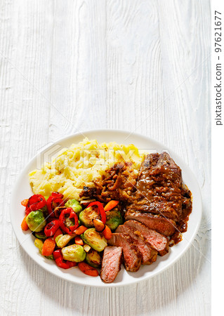 beef steak with potato mash and roasted vegetables beef steak with potato mash and roasted vegetables 97621677