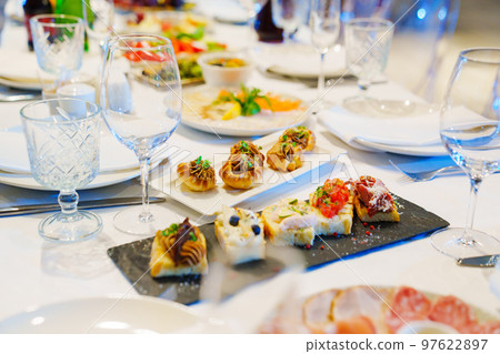 snacks and empty wine glasses on the table. catering snacks and empty wine glasses on the table. catering 97622897