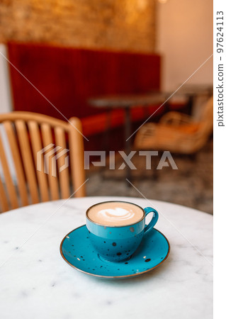 Cup of cappuccino coffee and beautiful heart Latte Art at city cafe shop, Valentine's day concept Cup of cappuccino coffee and beautiful heart Latte Art at city cafe shop, Valentine's day concept 97624113