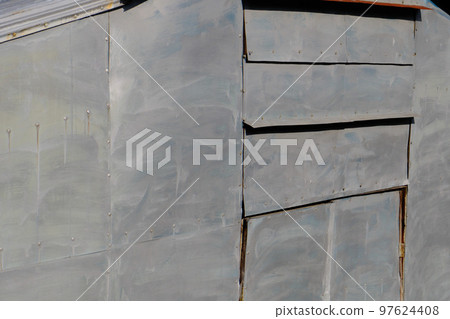 Gray wall pasted on the wall of a house under construction Gray wall pasted on the wall of a house under construction 97624408