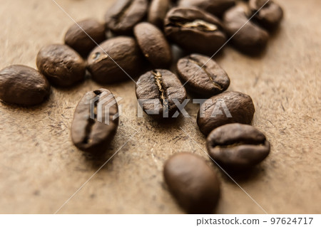 Falling Roasted Coffee Beans, Macro Shot, close-up. 97624717