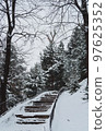 A stairs in the forest among pines and fir trees in winter 97625352