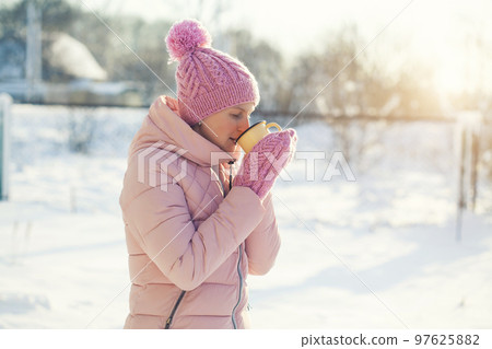 Smiling Woman with Mug Outdoor. Laughing Girl Outdoors with Hot Drink 97625882