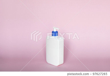 White unbranded bottle with a dispenser isolated on pink background. cosmetic packaging mockup with copy space. Bottle for a shower, gel, soap. 97627265