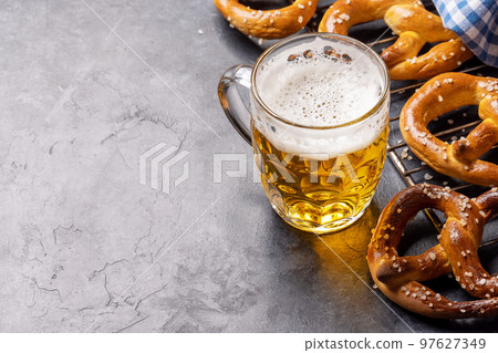 Freshly baked homemade pretzels and draft beer 97627349