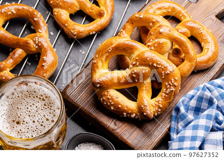 Freshly baked homemade pretzels and beer Freshly baked homemade pretzels and beer 97627352