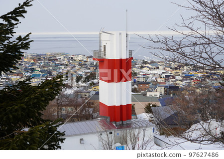 Spring is approaching with Monbetsu Lighthouse and drift ice in the distance Spring is approaching with Monbetsu Lighthouse and drift ice in the distance 97627486