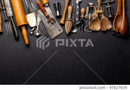Cooking utensils on kitchen table Cooking utensils on kitchen table 97627639