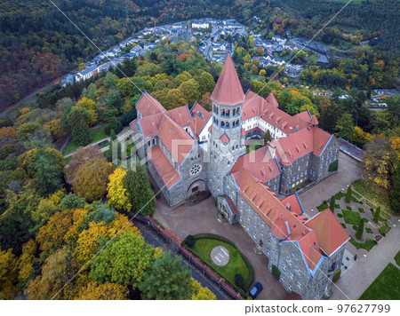 Aerial drone Shot of Abbey in Clervaux, Luxembourg in mystery evening twilight Aerial drone Shot of Abbey in Clervaux, Luxembourg in mystery evening twilight 97627799