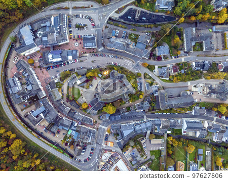 Aerial drone Shot of town CLervaux on the north of Luxembourg. Twilight evening scene with Castle and Cathedral 97627806