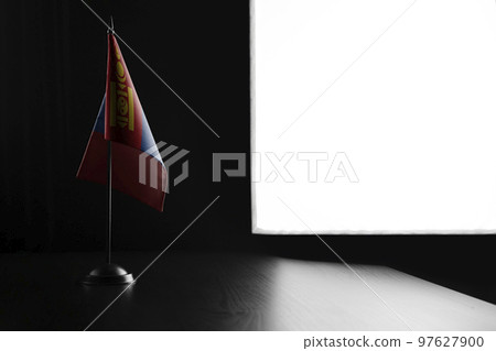 Small national flag of the Mongolia on a black background 97627900
