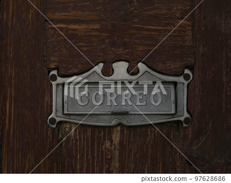 Iron letterbox on obsolete wooden background Iron letterbox on obsolete wooden background 97628686