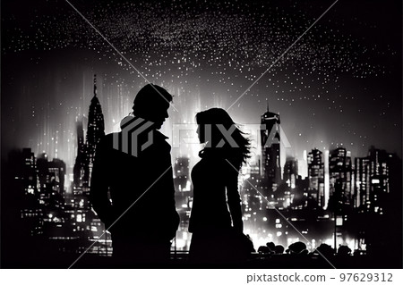 Romantic moment between teenage couple in silhouette against blur of the city at night. 97629312