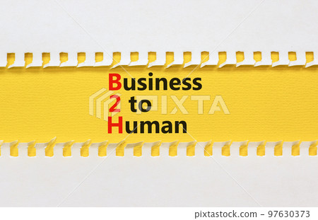 B2H business to human symbol. Concept words B2H business to human on white white paper on a beautiful yellow background. Business and B2H business to human concept. Copy space. B2H business to human symbol. Concept words B2H business to human on white white paper on a beautiful yellow background. Business and B2H business to human concept. Copy space. 97630373
