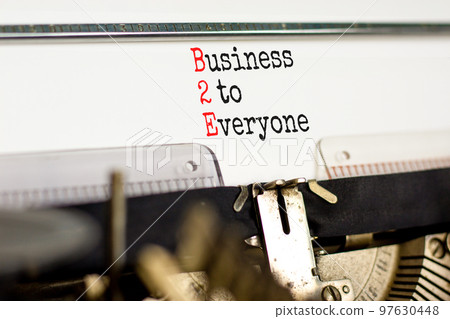 B2E business to everyone symbol. Concept words B2E business to everyone typed on old retro typewriter. Beautiful white background. Business and B2E business to everyone concept. Copy space. 97630448