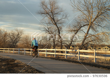 male cyclist is riding a gravel bike 97630506