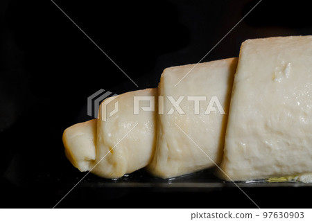 Uncooked homemade croissant on tray in electric oven 97630903
