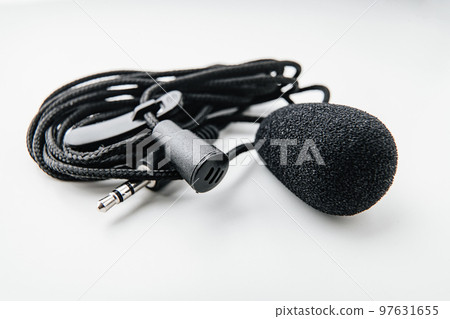 Buttonhole on a white background. Compact microphone for audio recording. Buttonhole on a white background. Compact microphone for audio recording. 97631655