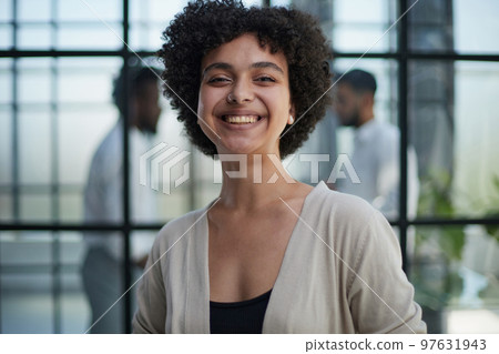 business woman with her staff in background at office business woman with her staff in background at office 97631943